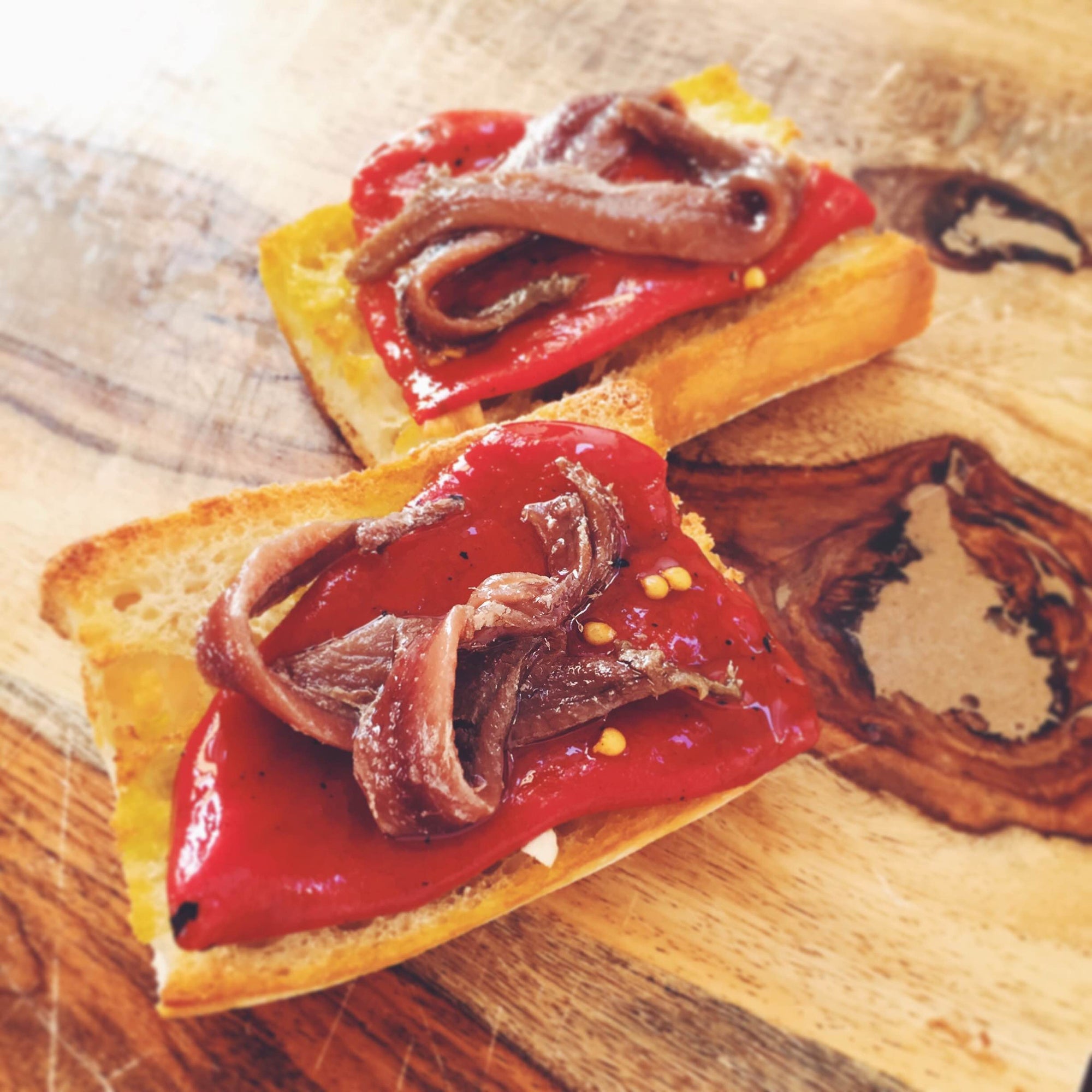 Piquillo Peppers and Anchovies on Garlic Toast