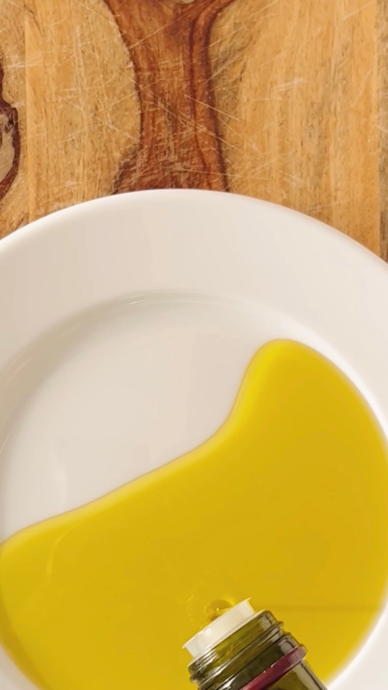Donostia Foods Extra Virgin Olive Oil poured on a white plate