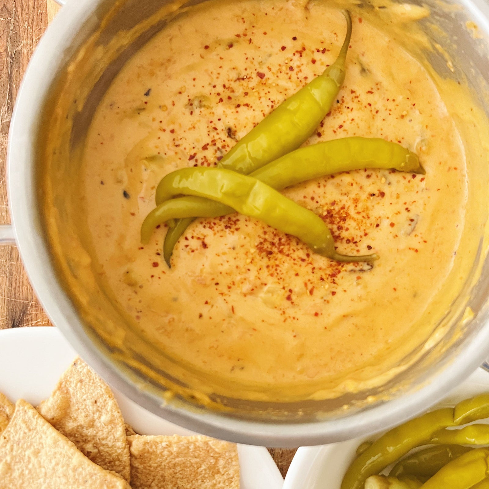 Donostia Foods Fire-Roasted Tomato & Queso Dip with Guindilla Peppers and Piment d'Espelette on top.