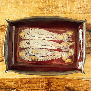 Donostia Tinned Fish Dish - Three Fish Version No. 1 November 2025, red and gold and white, with hand drawn fish and pinched corners.
