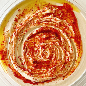 Donostia Foods EVOO and Piment d'Espelette swirled into hummus.