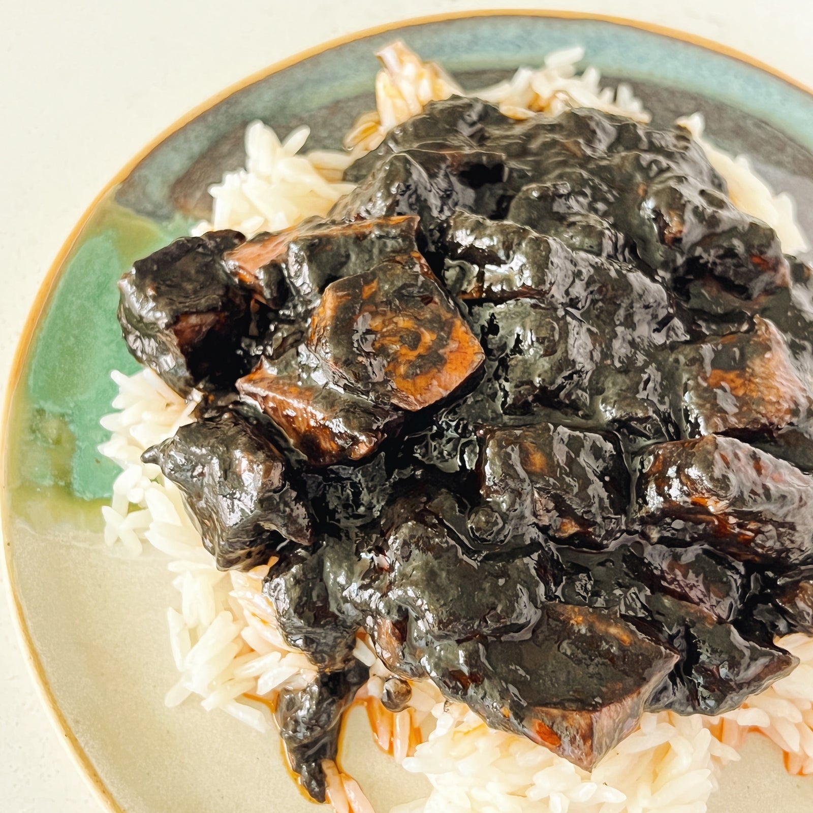 Donostia Foods Squid in Ink and Donostia Foods Calasparra Rice on Susan Volk Artisan Pintxo Plate