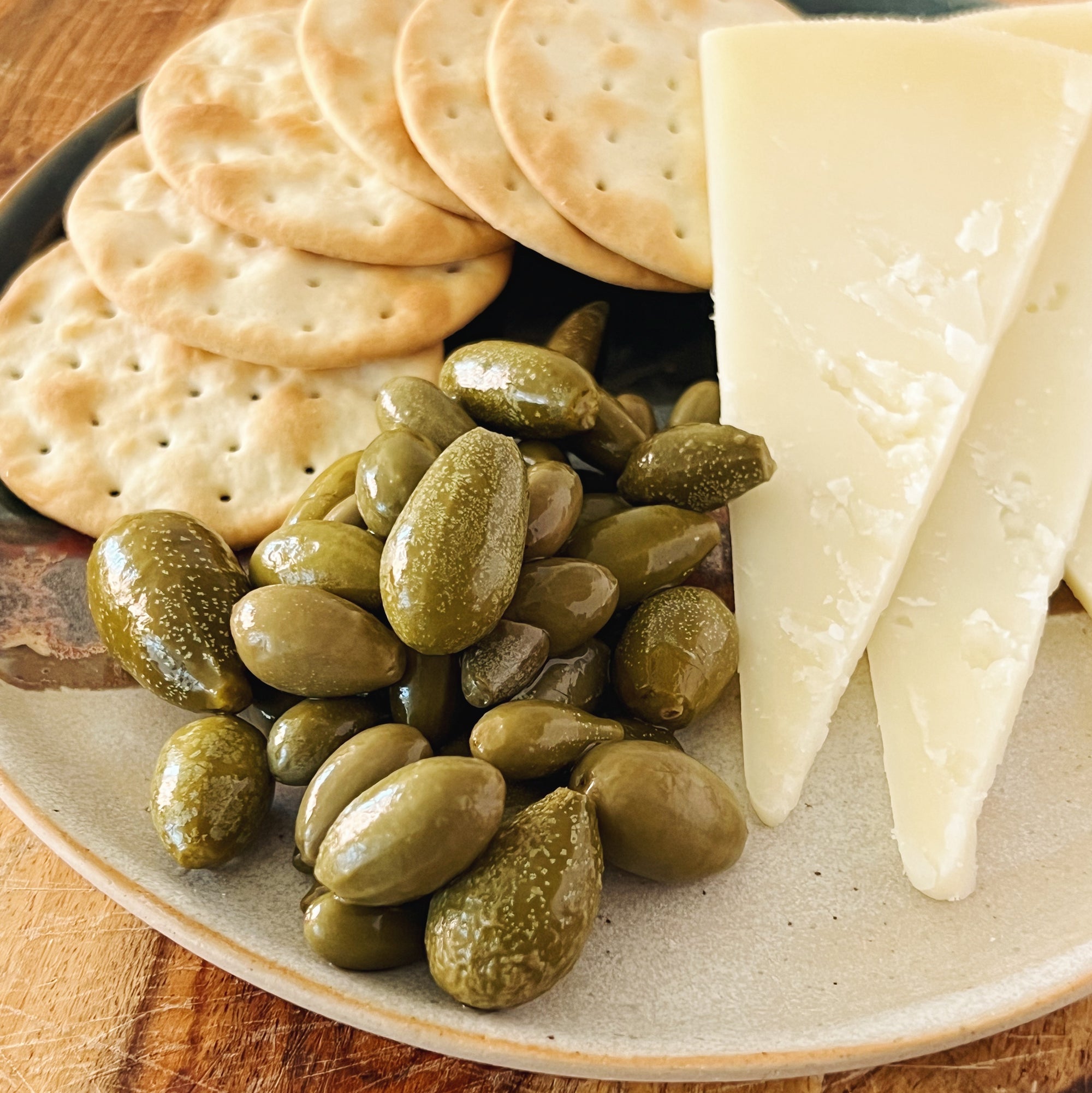 Donostia Foods Tears of Caperberries with classic water crackers and a nice mild sheep's cheese.