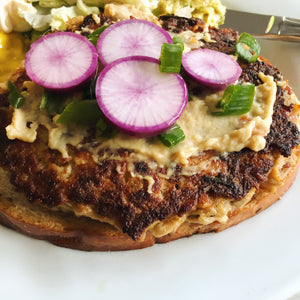 Canned mackerel cakes with purple ninja radishes and roasted garlic hummus - Donostia Foods