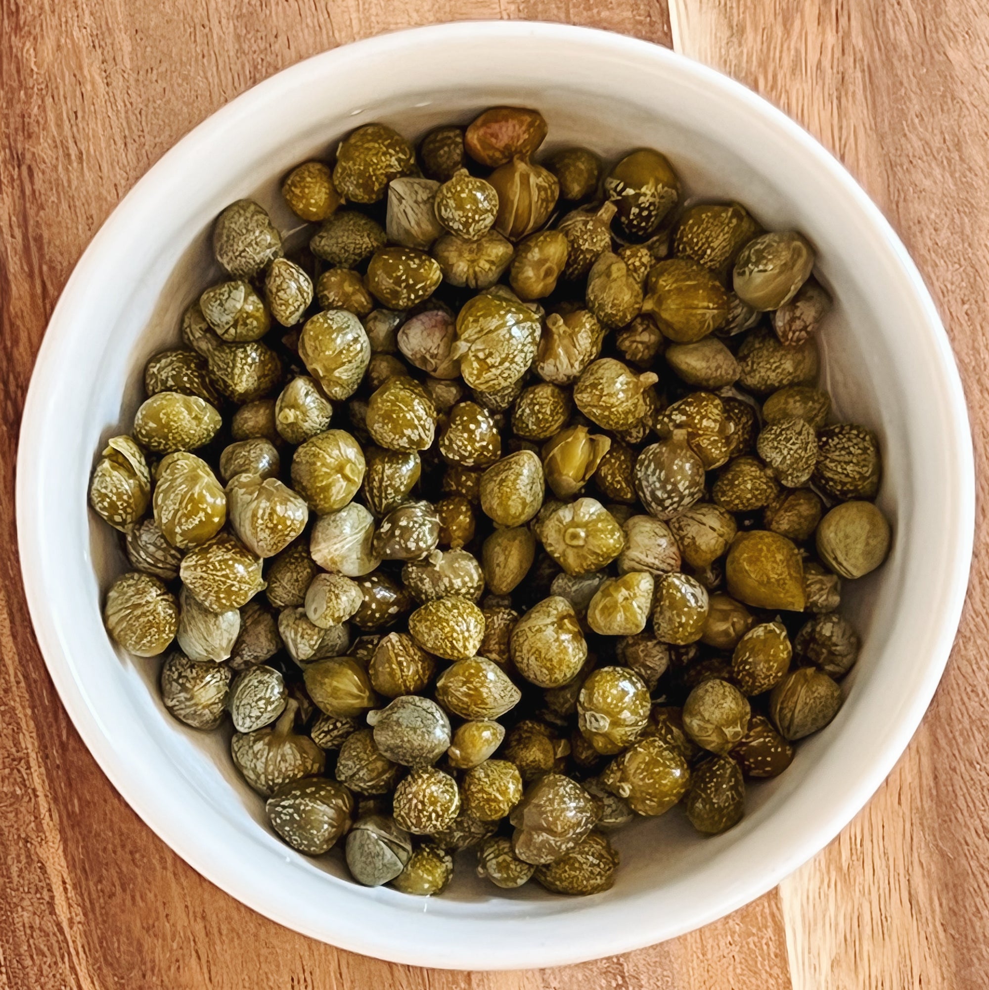Lilliput capers - a tiny bowl full of tiny capers - Donostia Foods