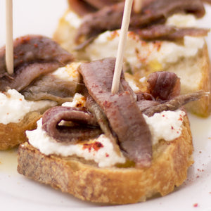 Cantabrian anchovies with ricotta (or mato) cheese and piment d'Espelette