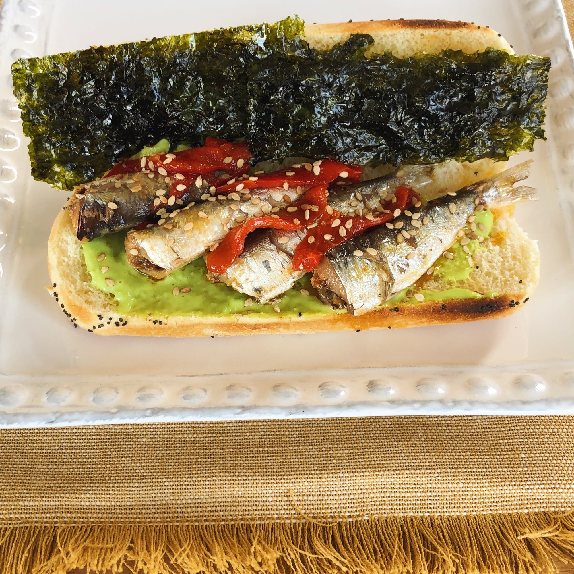 Sardinillas with piquillo pepper sandwich with wasabi mayo and seaweed