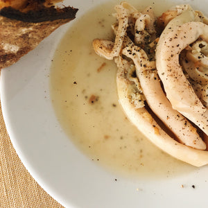 Tinned razor clams in white wine and garlic butter sauce.