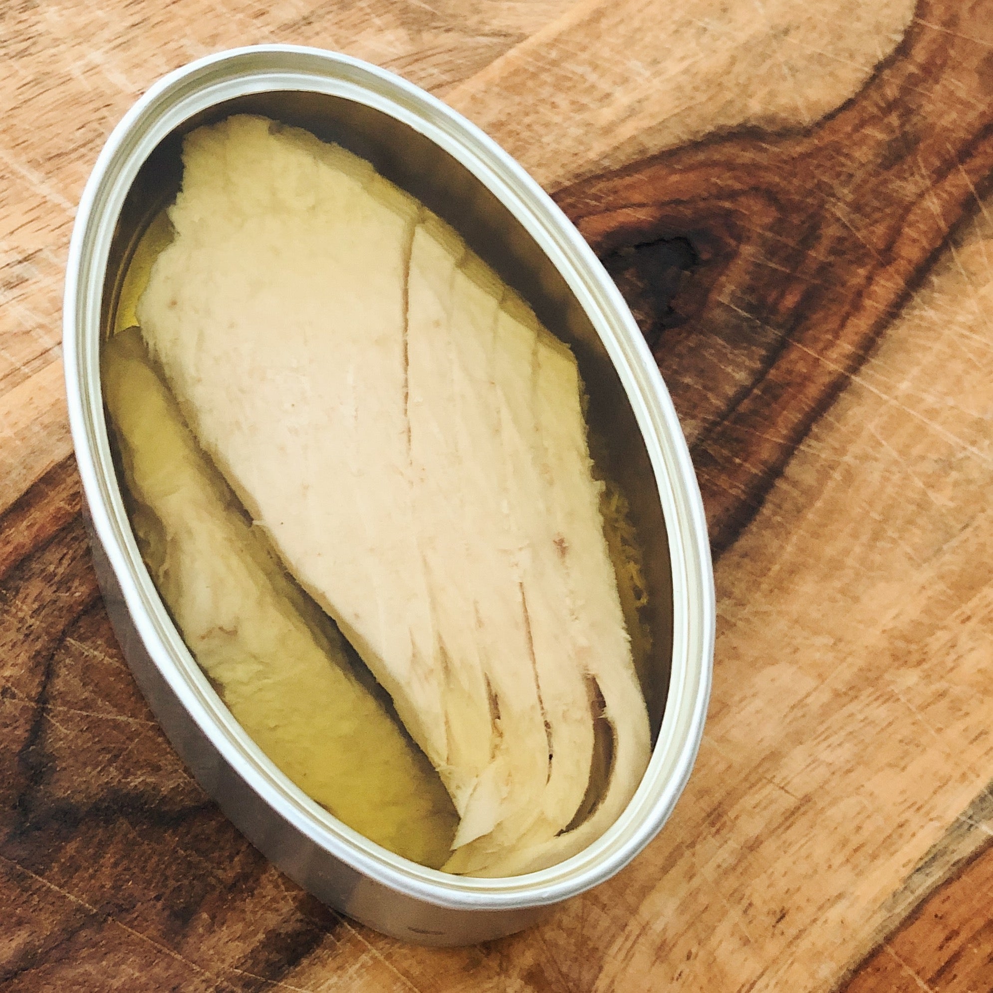 Ventresca tuna white tuna belly in an open tin - Donostia Foods